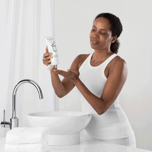 Woman washing her face with Balancing Cleansing Emulsion