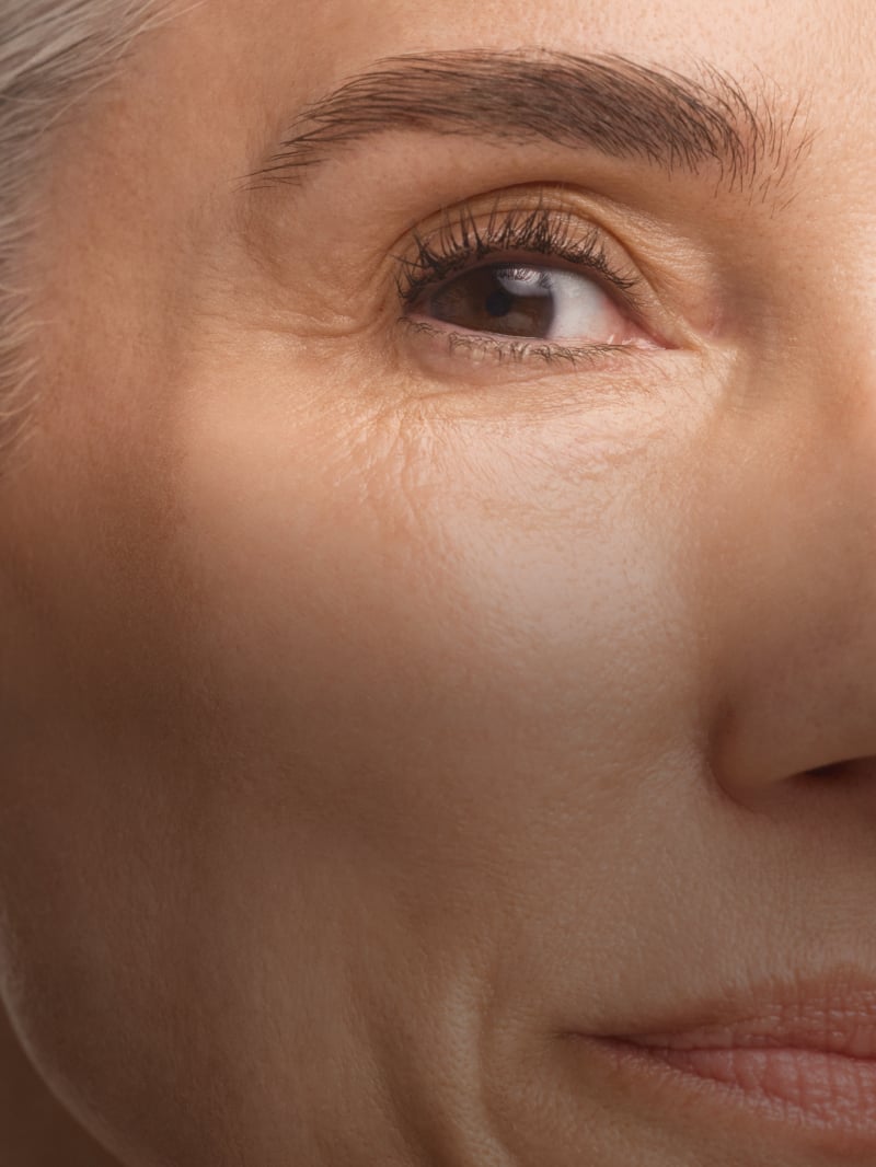 Close up of woman applying skincare