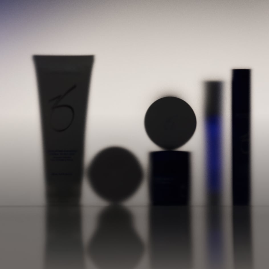 Luxury beauty products arranged with metallic accessories